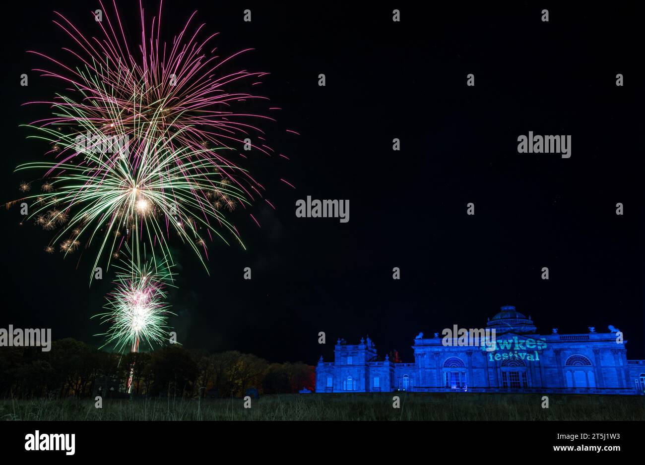 Gosford House, East Lothian, Scotland, UK, 5th November 2023. Fawkes Festival: the fireworks event takes place in the Gosford Estate to celebrate Guy Fawkes night. A large scale fireworks display bursts in the nght sky by the stately country mansion. Credit: Sally Anderson/Alamy Live News Stock Photo