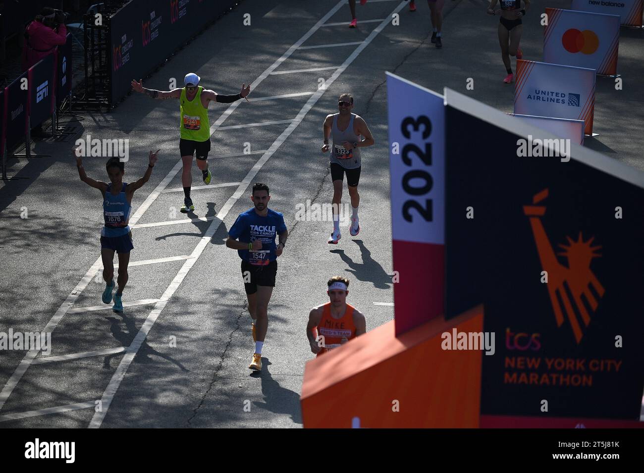 New York, USA. 05th Nov, 2023. Runners celebrate as the arrive at the