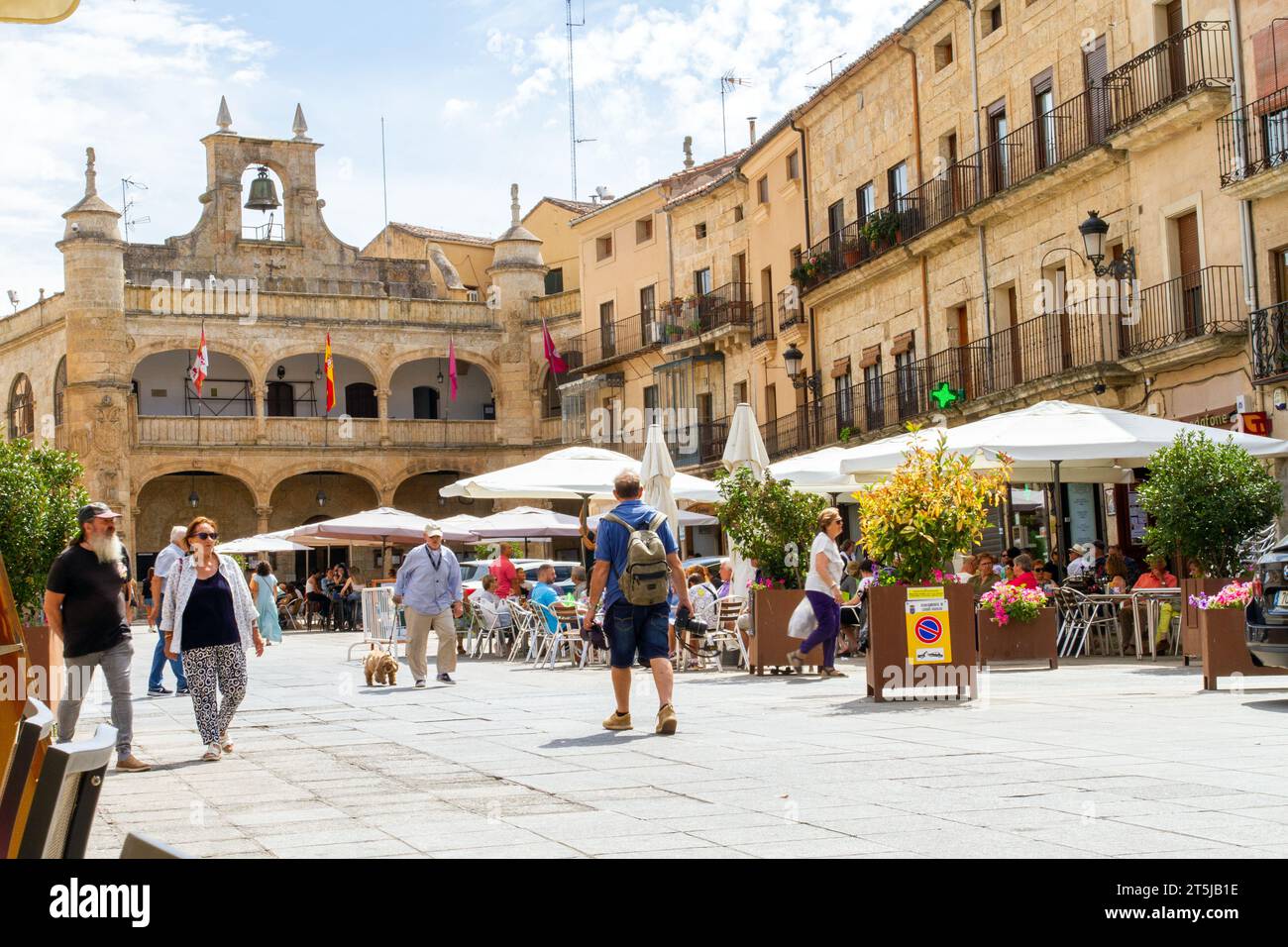 People enjoying the summer sunshine eating and drinking in the Plaza