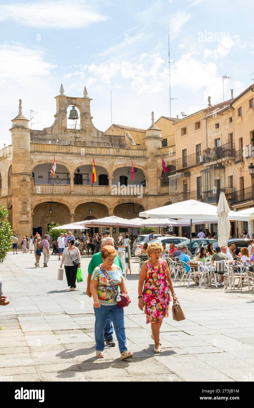 People enjoying the summer sunshine eating and drinking in the Plaza