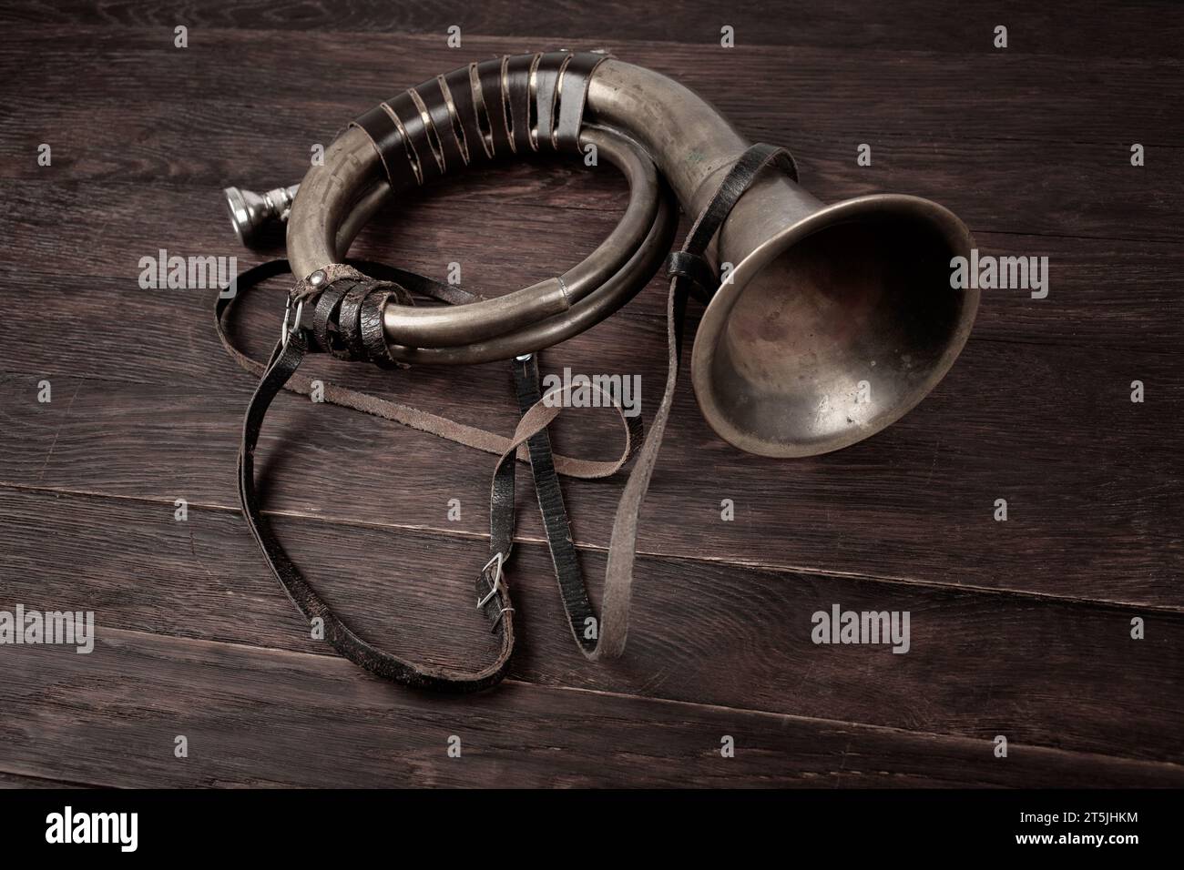 Hunting horn on rustic wood plank background Stock Photo - Alamy