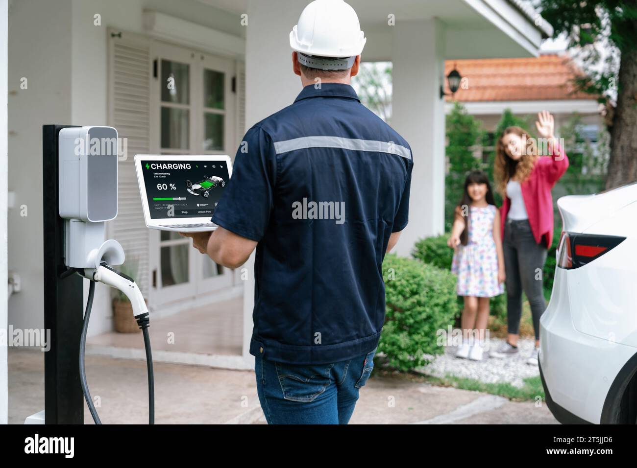 Qualified technician working on home EV charging station installation
