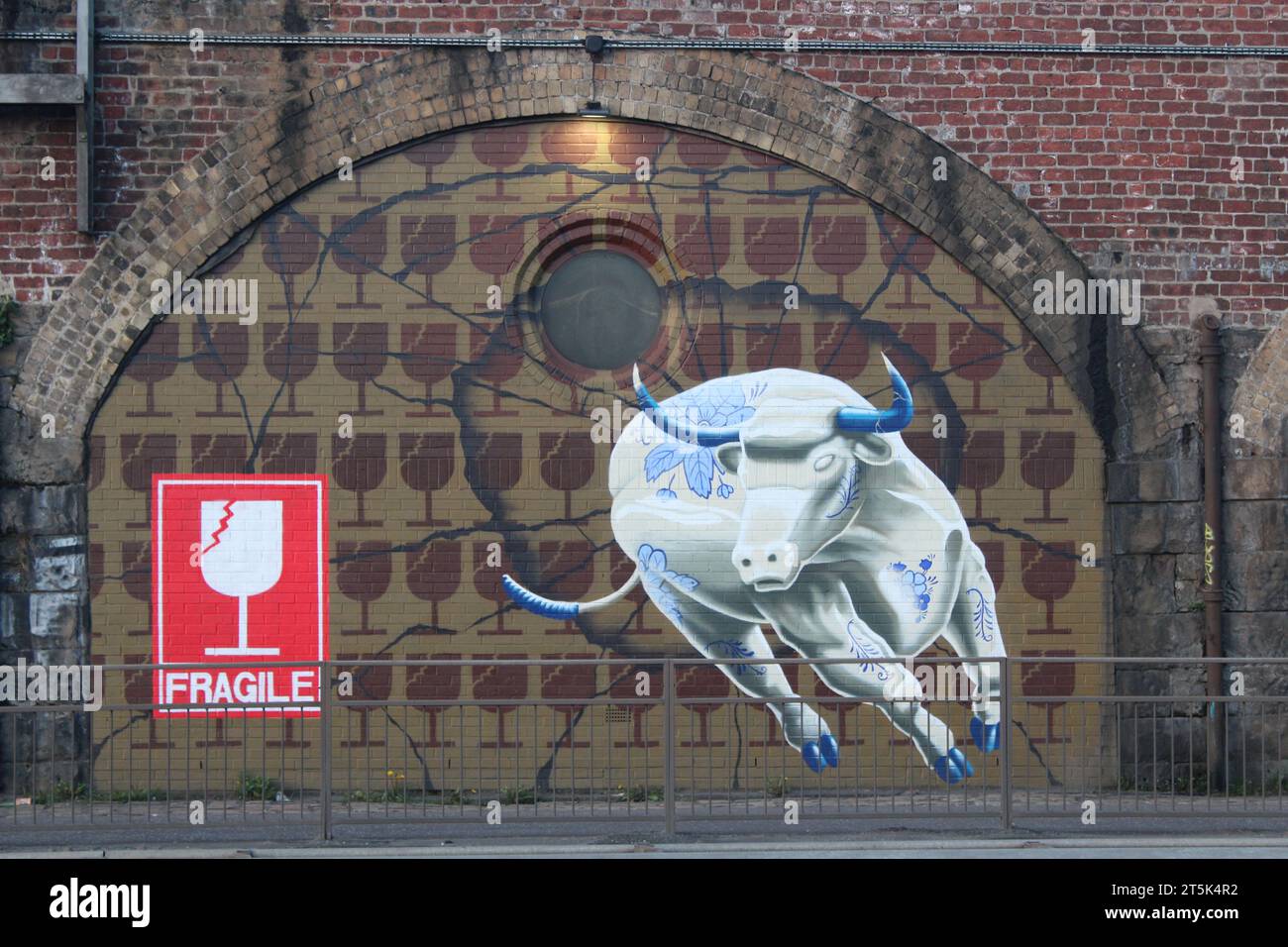Street Art of a bull made of fine china Stock Photo