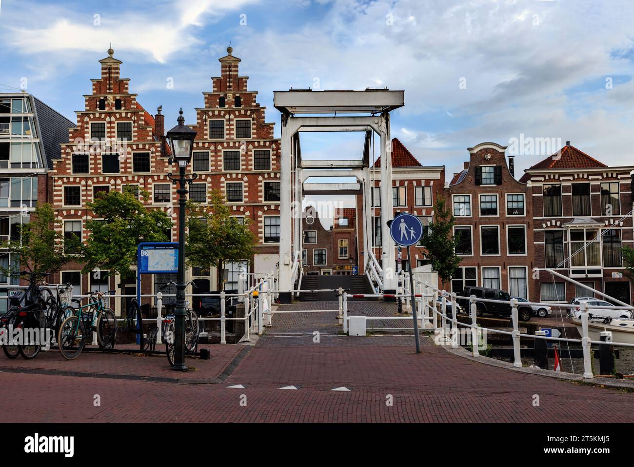 HAARLEM, NETHERLANDS - 02 September 2022: Gravestenenbrug bridge on Spaarne river and old houses in Haarlem, Netherlands Stock Photo