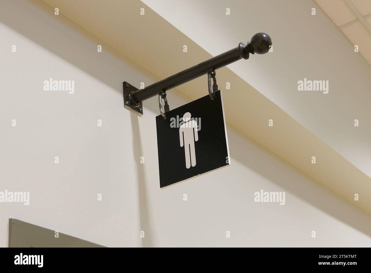 A man washroom logo on the wall Stock Photo