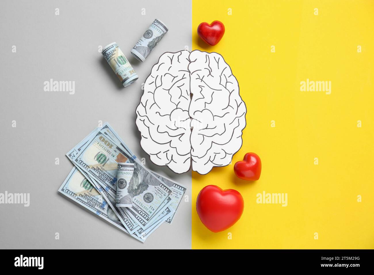 Emotional and rational. Paper human brain, dollar banknotes and red hearts on color background, flat lay Stock Photo