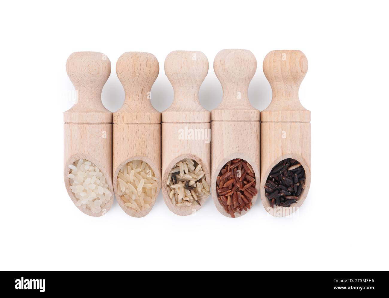 Different sorts of rice in scoops isolated on white, top view Stock ...
