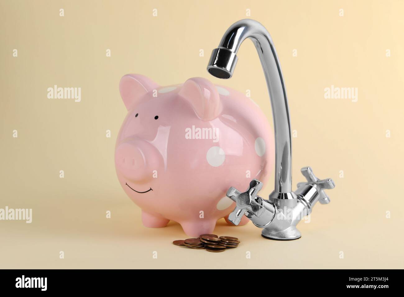 Water scarcity concept. Piggy bank, tap and coins on beige background ...