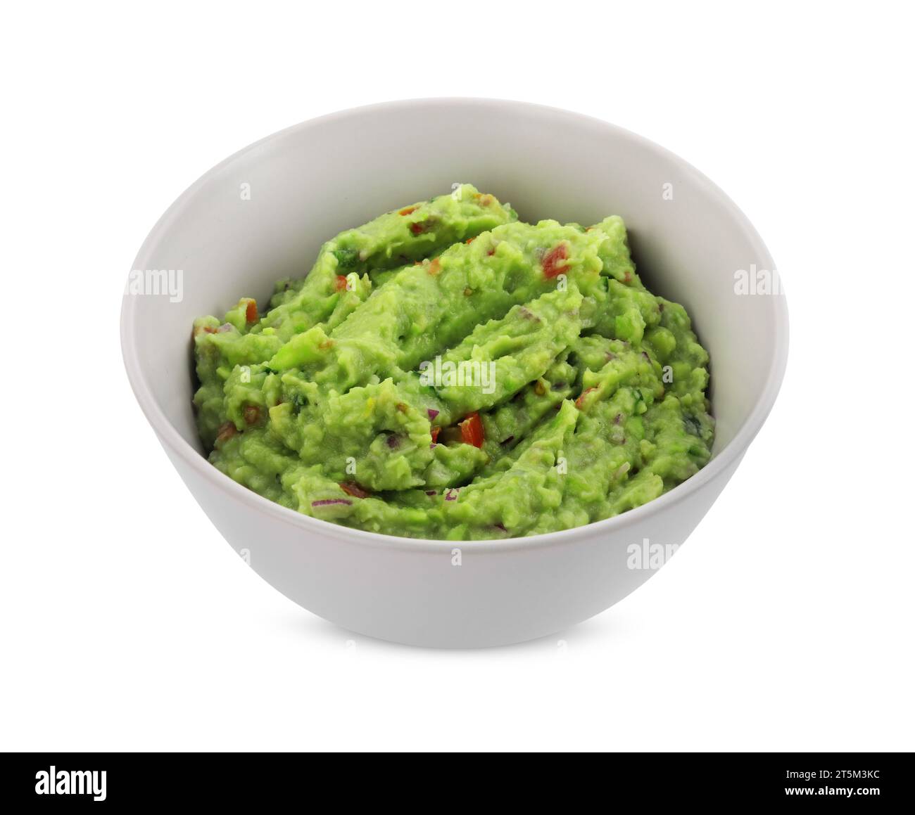 Bowl of delicious guacamole isolated on white Stock Photo
