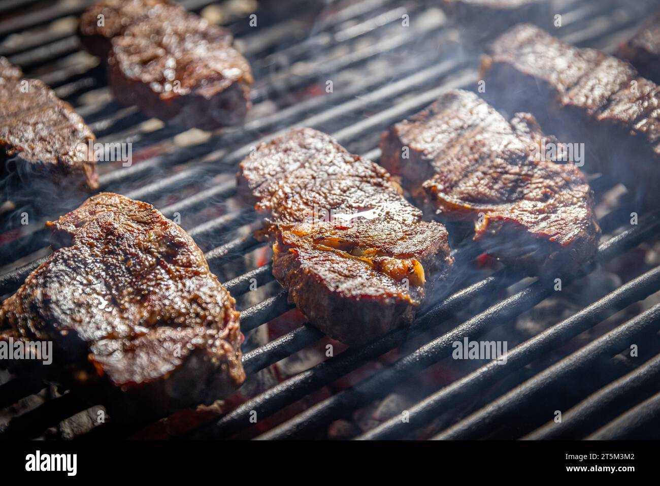 Closeup food grilled steak roast. Beef steaks on grill Stock Photo Alamy