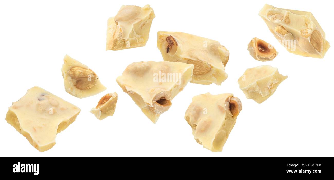 Broken white chocolate bar with hazelnut isolated on white background Stock Photo