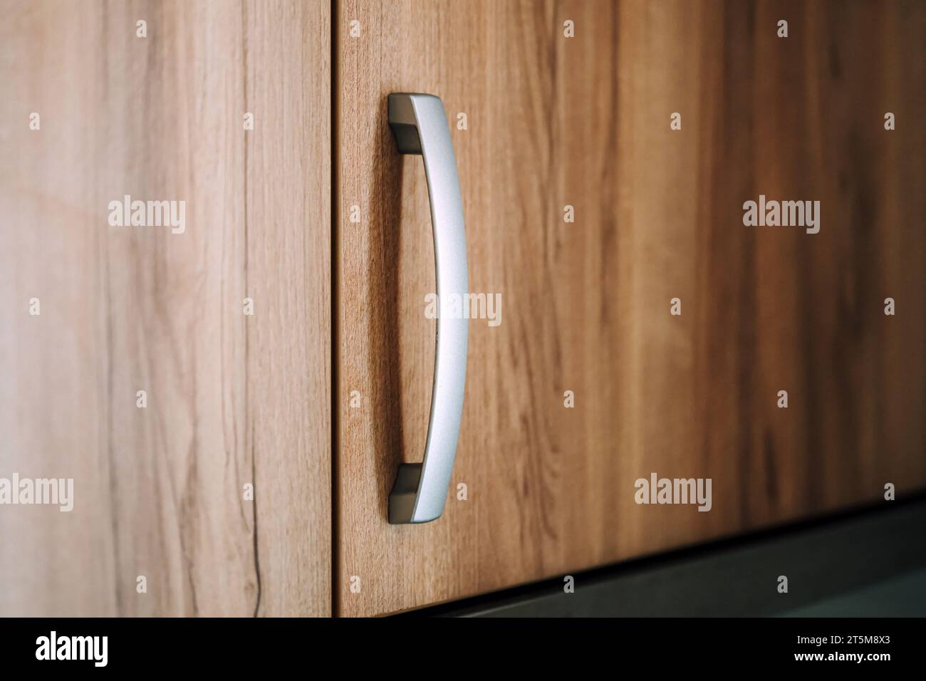 Kitchen cabinet handle, close up with selective focus Stock Photo