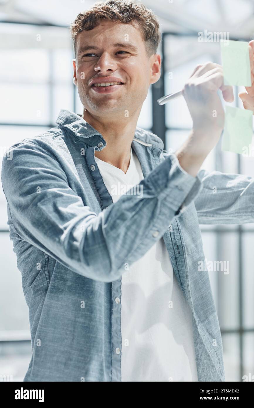 Businessman, sticky notes and work schedule for project planning Stock Photo