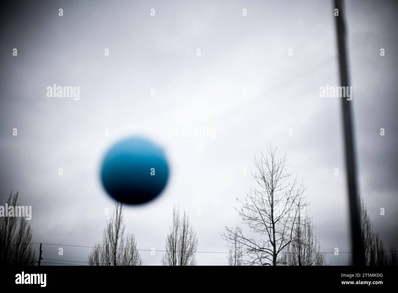 A Tether ball swinging at a school playground Stock Photo Alamy