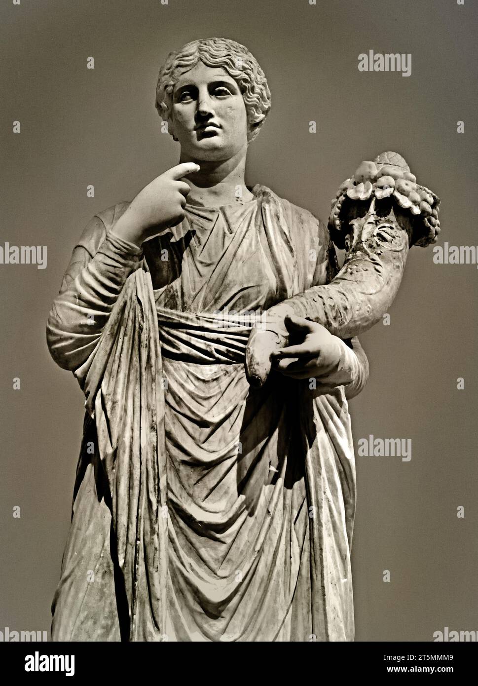 Concordia ( draped female statue) deity holds a cornucopia a symbol of prosperity from Pompeii, Eumachia, 1st Century AD ,                                 National Archaeological Museum of Naples Italy. Stock Photo