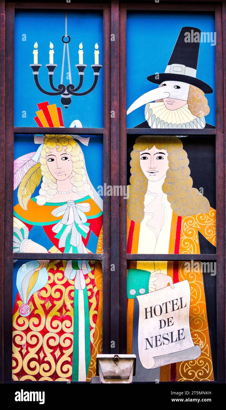 Painted mural in window above the entrance to the Hotel de Nesle, Paris 6, France. Stock Photo
