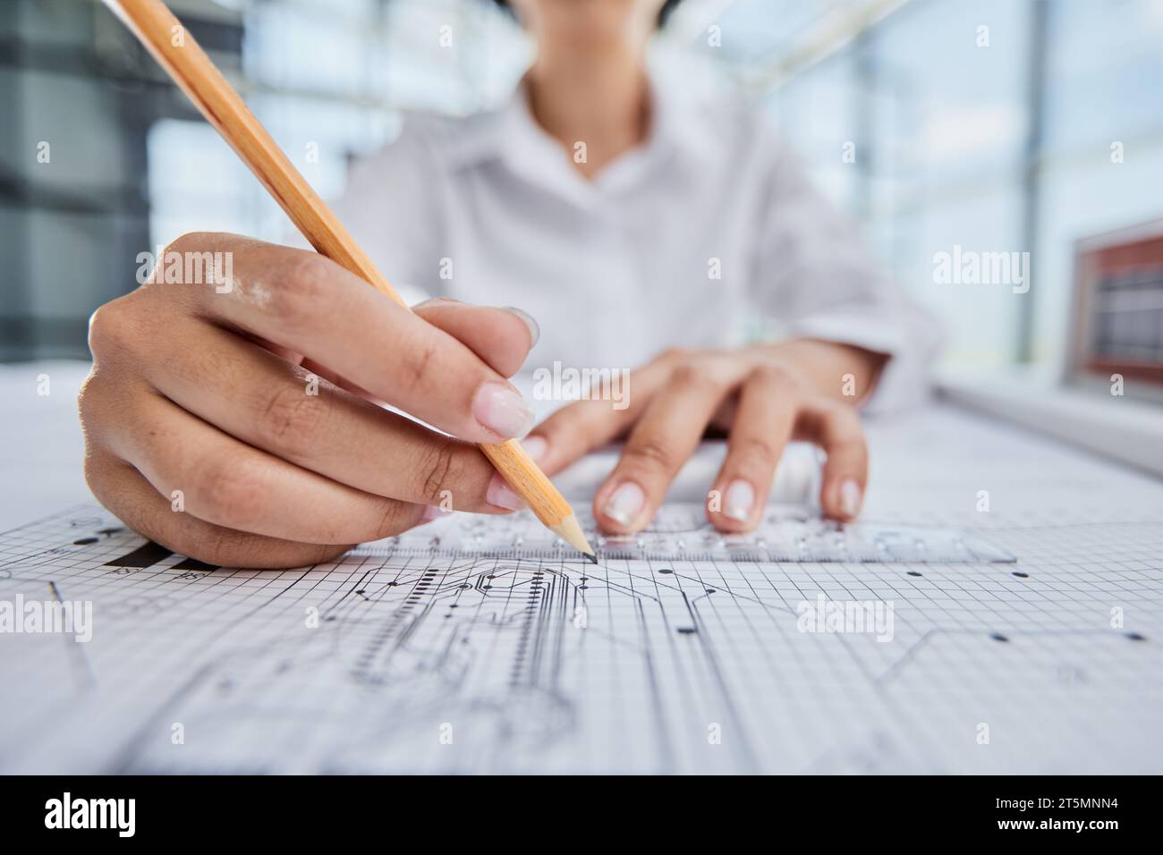 female architect designer working on blueprints Stock Photo