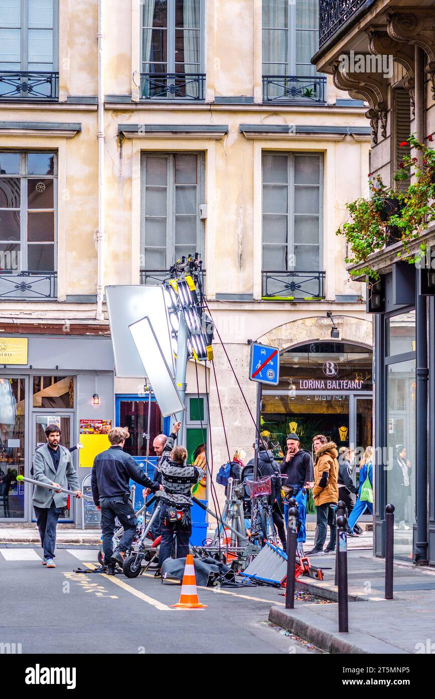 Film crew with lights operating on the Rue de Nesle, Paris 6, France. Stock Photo