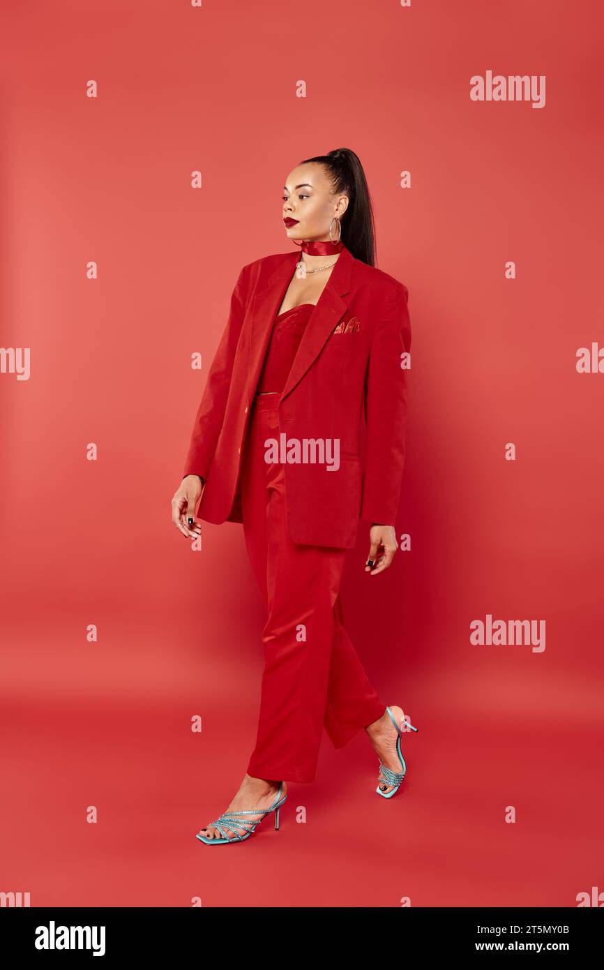 African woman walking in suit hi-res stock photography and images - Alamy