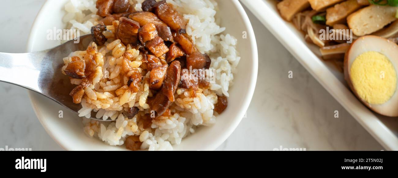Braised meat rice, stewed pork over cooked rice in Taiwanese restaurant. Stock Photo