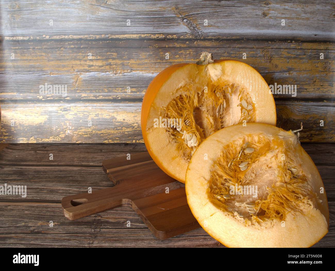 Inside  and  close  up  of  large orange  pumpkin showing  seed and  pith Stock Photo