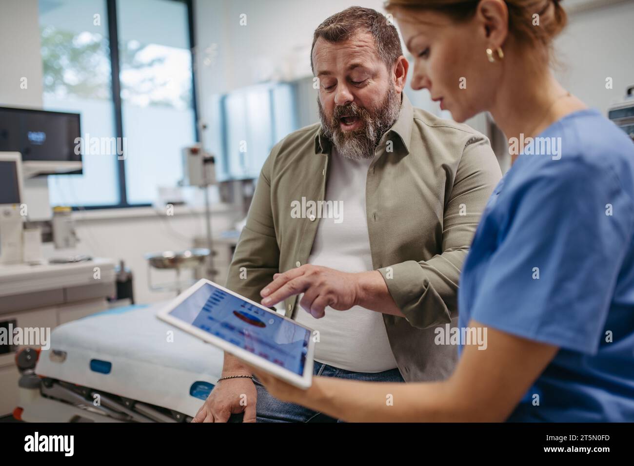 Female doctor consulting with overweight patient, discussing test