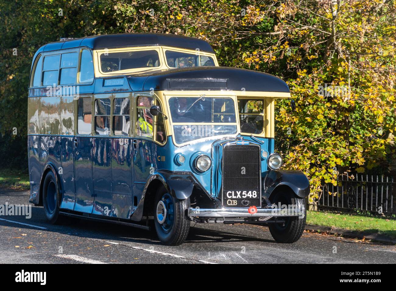 5th November 2023. Participants in the London to Brighton Veteran Car Run 2023 driving through West Sussex, England, UK. An old Leyland Cub SKPZ2 bus dating from 1936 following the route. Stock Photo