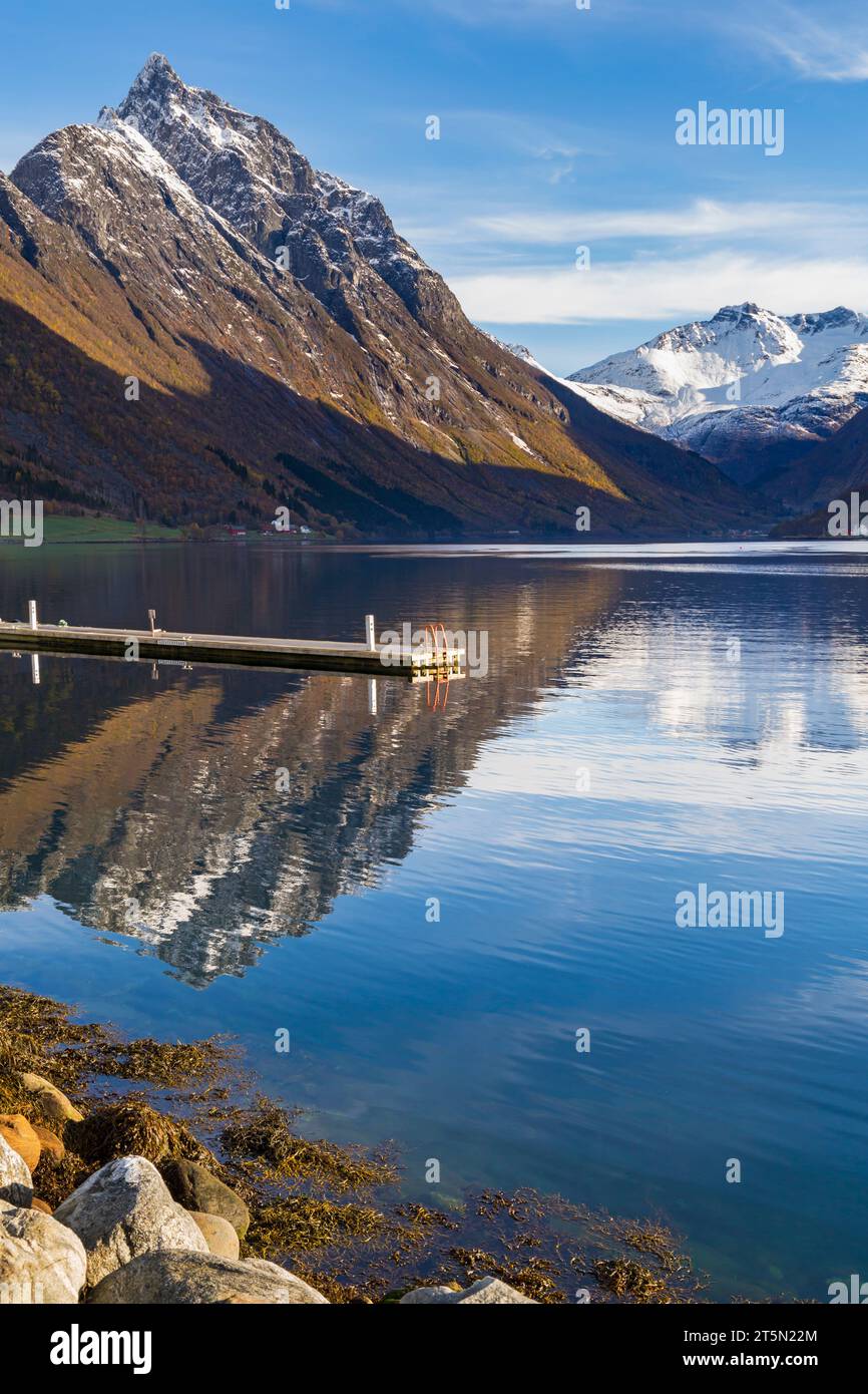 Stunning scenery with mountains and reflections of Hjorundfjorden fjord Hjorundfjordn at Urke, Norway, Scandinavia, Europe in October Stock Photo