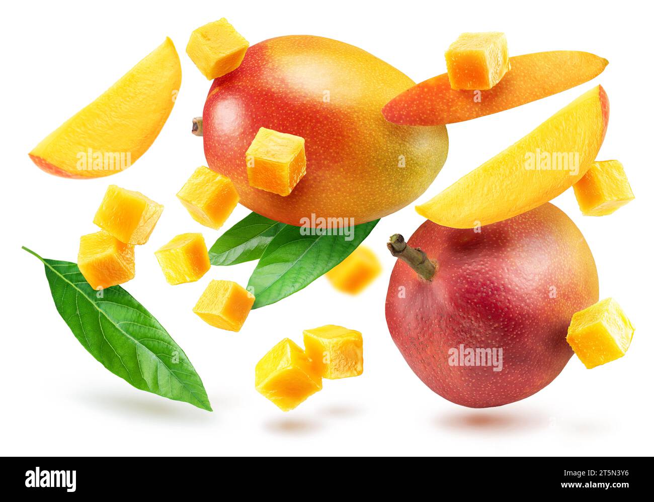 Mango fruit and mango slices flying isolated on white background. Stock Photo