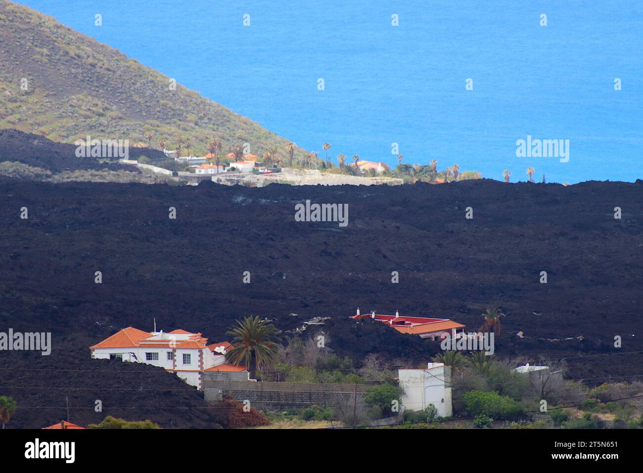 Homes and business properties engulfed in lava flow and volcanic ash ejected from the eruption at Cumbre Vieja Volcanic Ridge, La Palma, 2022. Stock Photo