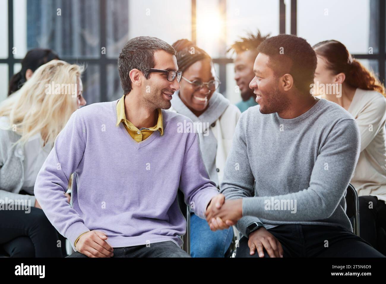 Happy multiethnic employees having fun while discussing project, Stock Photo