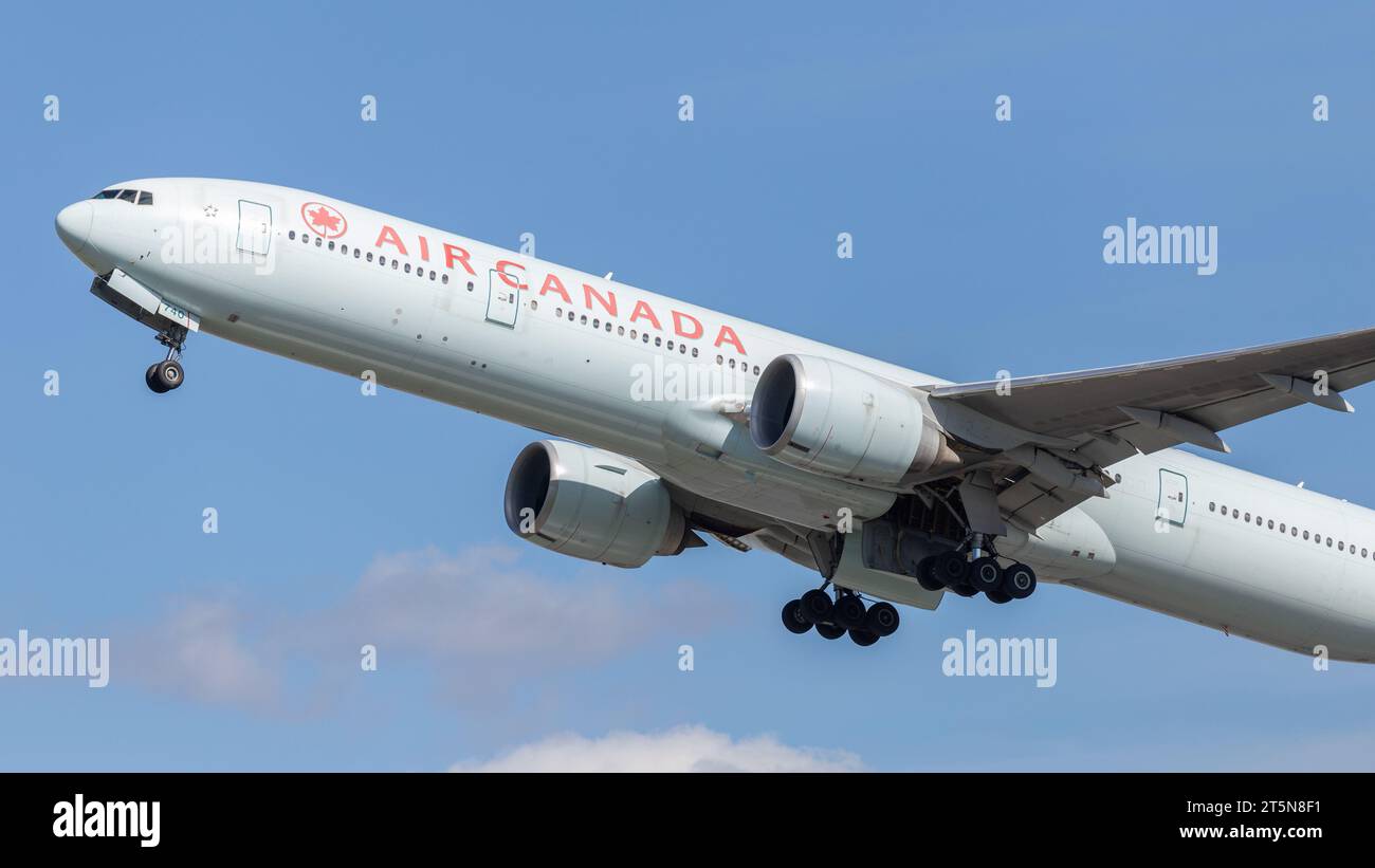 Air Canada Boeing 777-333ER, registration C-FIVQ taking off from London Heathrow LHR in perfect conditions on a September afternoon Stock Photo