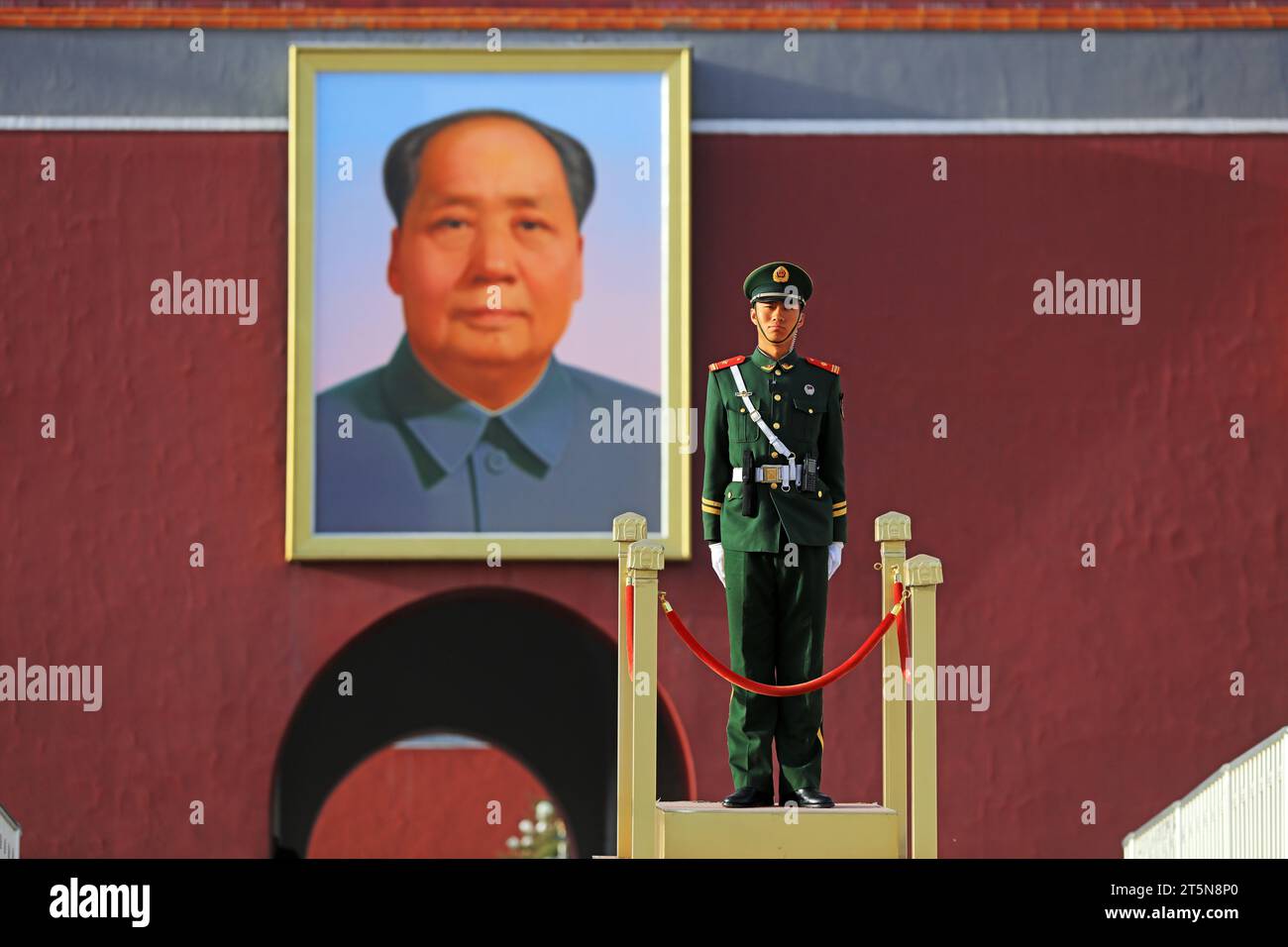 Beijing, China - March 29, 2019: Armed Police Soldiers Stand Off guard under a Giant Portrait of Mao Zedong, Beijing, China Stock Photo