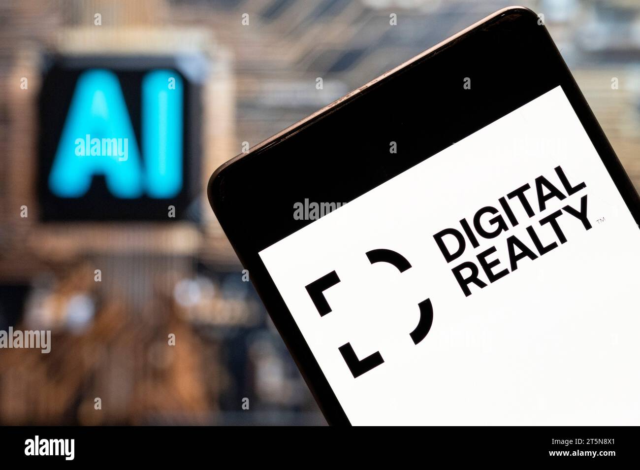 China. 03rd Nov, 2023. In this photo illustration, the real estate investment trust company Digital Realty logo seen displayed on a smartphone with an Artificial intelligence (AI) chip and symbol in the background. (Photo by Budrul Chukrut/SOPA Images/Sipa USA) *** Strictly for editorial news purposes only *** Credit: Sipa USA/Alamy Live News Stock Photo