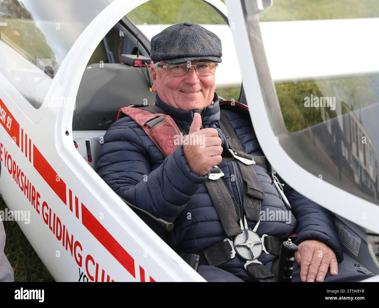 businessman George Vardy being prepared for a gliding lesson at The Yorkshire Gliding Club at Sutton Bank, North Yorkshire Stock Photo