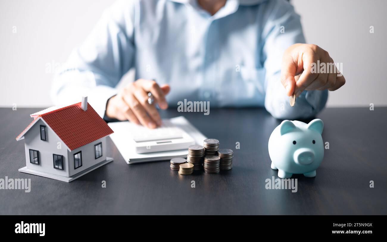 House with money. Concept of finance or refinance real estate. Symbol of house stands against background of us dollars. Property investment. Home mort Stock Photo