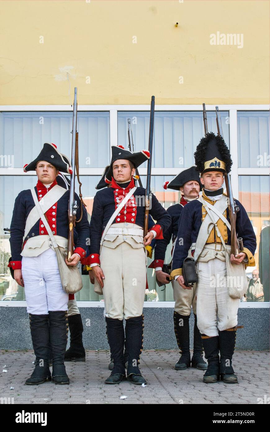 Reenactors in historic uniforms on city streets before Reenactment of the Siege of Neisse during Napoleonic War with Prussia in 1807, in Nysa, Poland Stock Photo