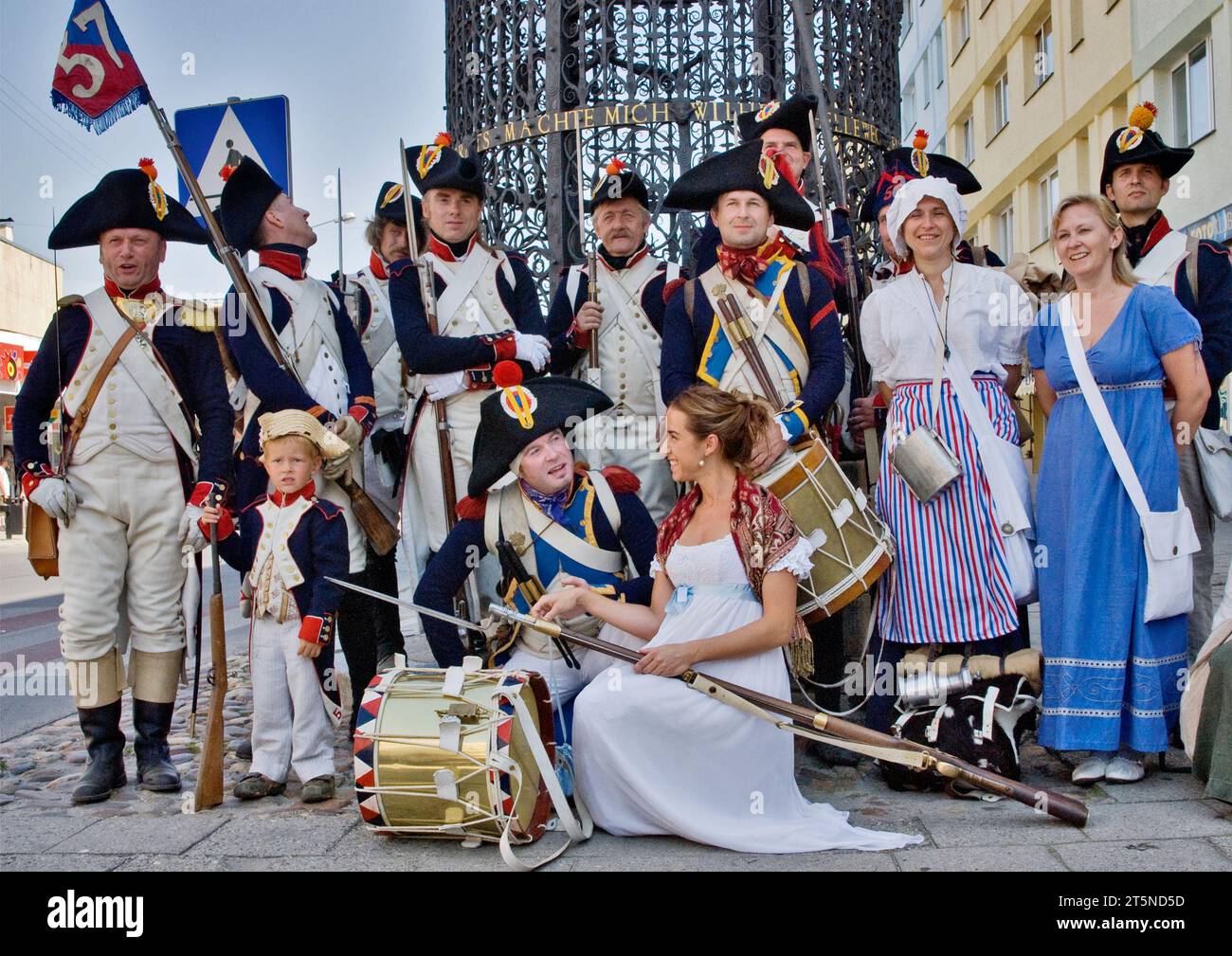 Reenactors In Historic Uniforms At Historic Well Before Reenactment Of reenactors-in-historic-uniforms-at-historic-well-before-reenactment-of