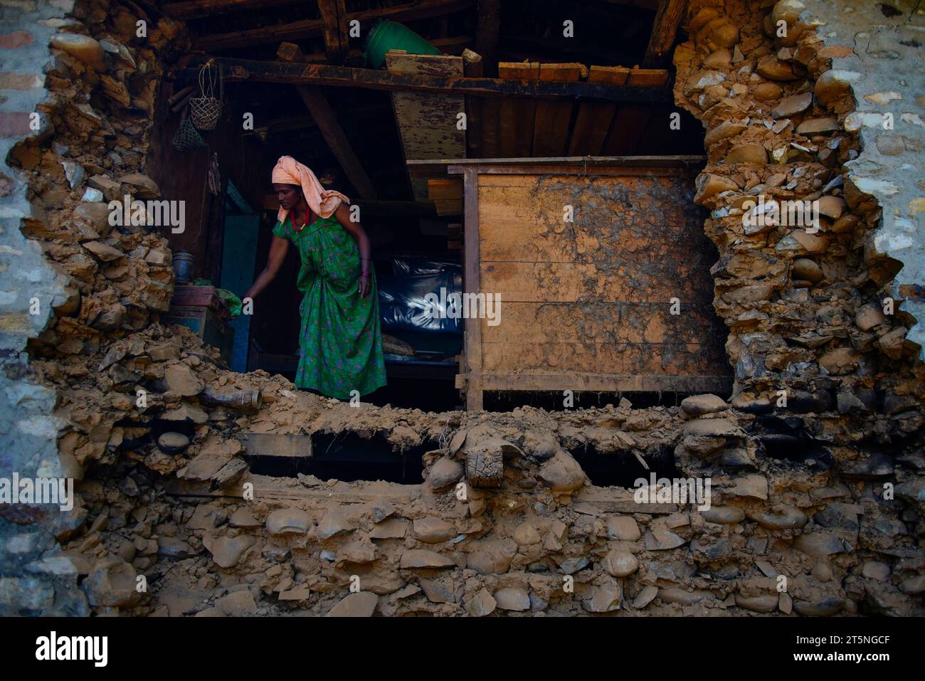 Jajarkot, Nepal. 6th Nov, 2023. A woman looks for her belongings in her destroyed home after a powerful earthquake that hit Jajarkot and Rukum districts, leaving more than 157 dead and 200 people injured in Jajarkot, Nepal on Monday, November 6, 2023. (Credit Image: © Skanda Gautam/ZUMA Press Wire) EDITORIAL USAGE ONLY! Not for Commercial USAGE! Credit: ZUMA Press, Inc./Alamy Live News Stock Photo