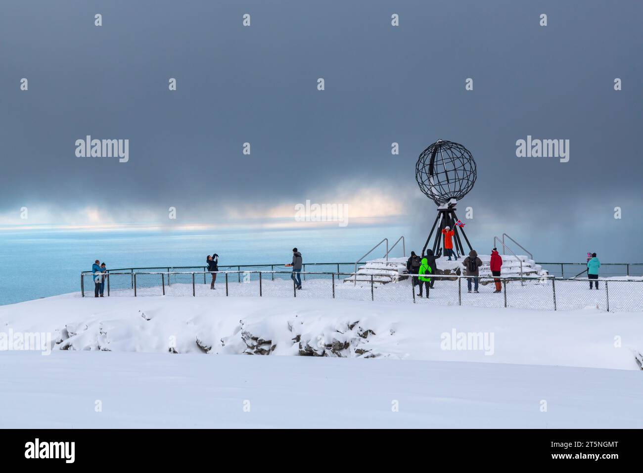 Dramatic weather with a mixture of snow and sunshine at the Globe monument structure, North Cape, Nordkapp, Norway, Scandinavia, Europe in October Stock Photo