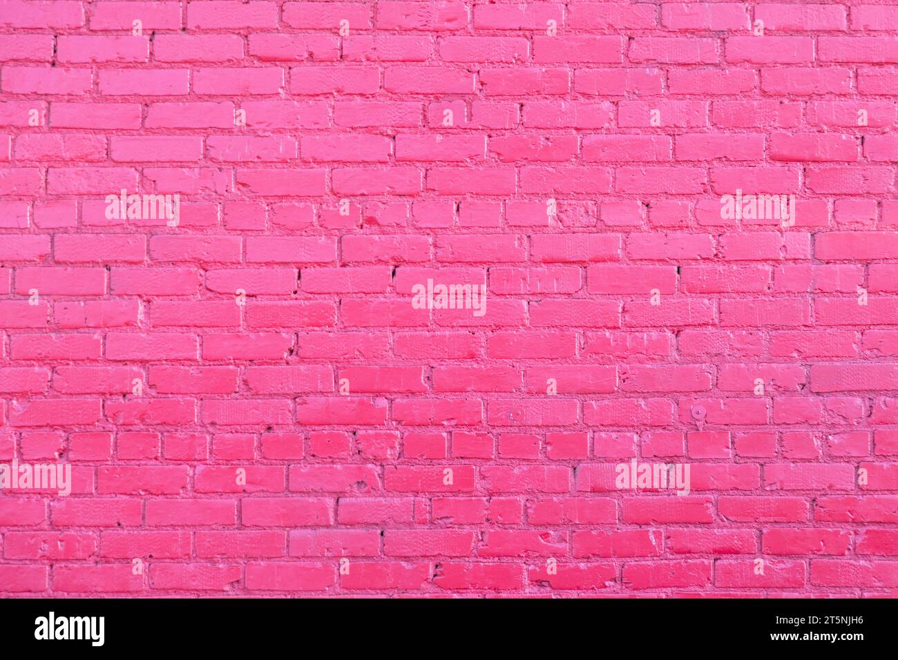 pattern of pink painted old brick wall Stock Photo
