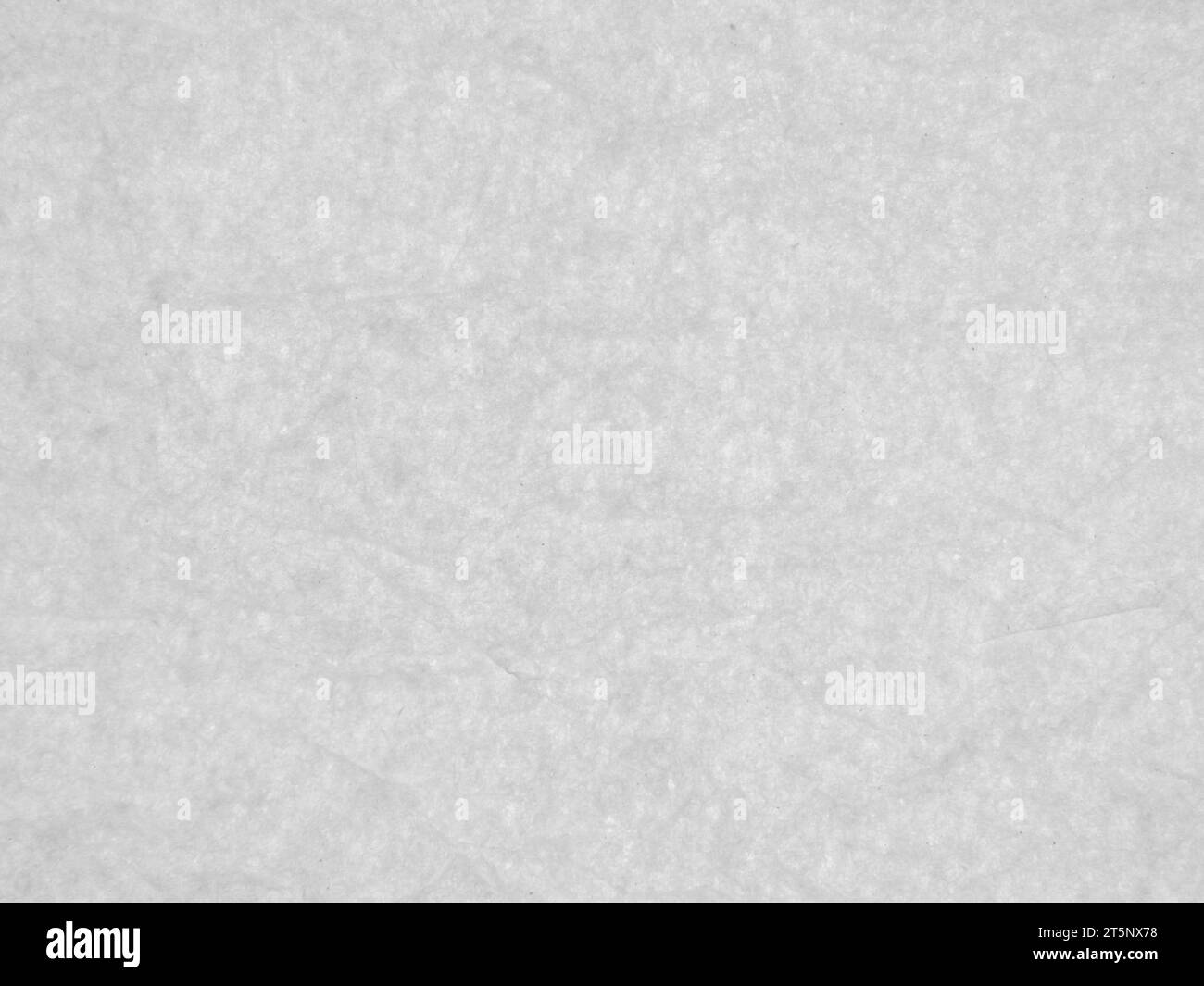 Slightly wrinkled paper sheet. Subtle texture. Low contrast background. Stock Photo