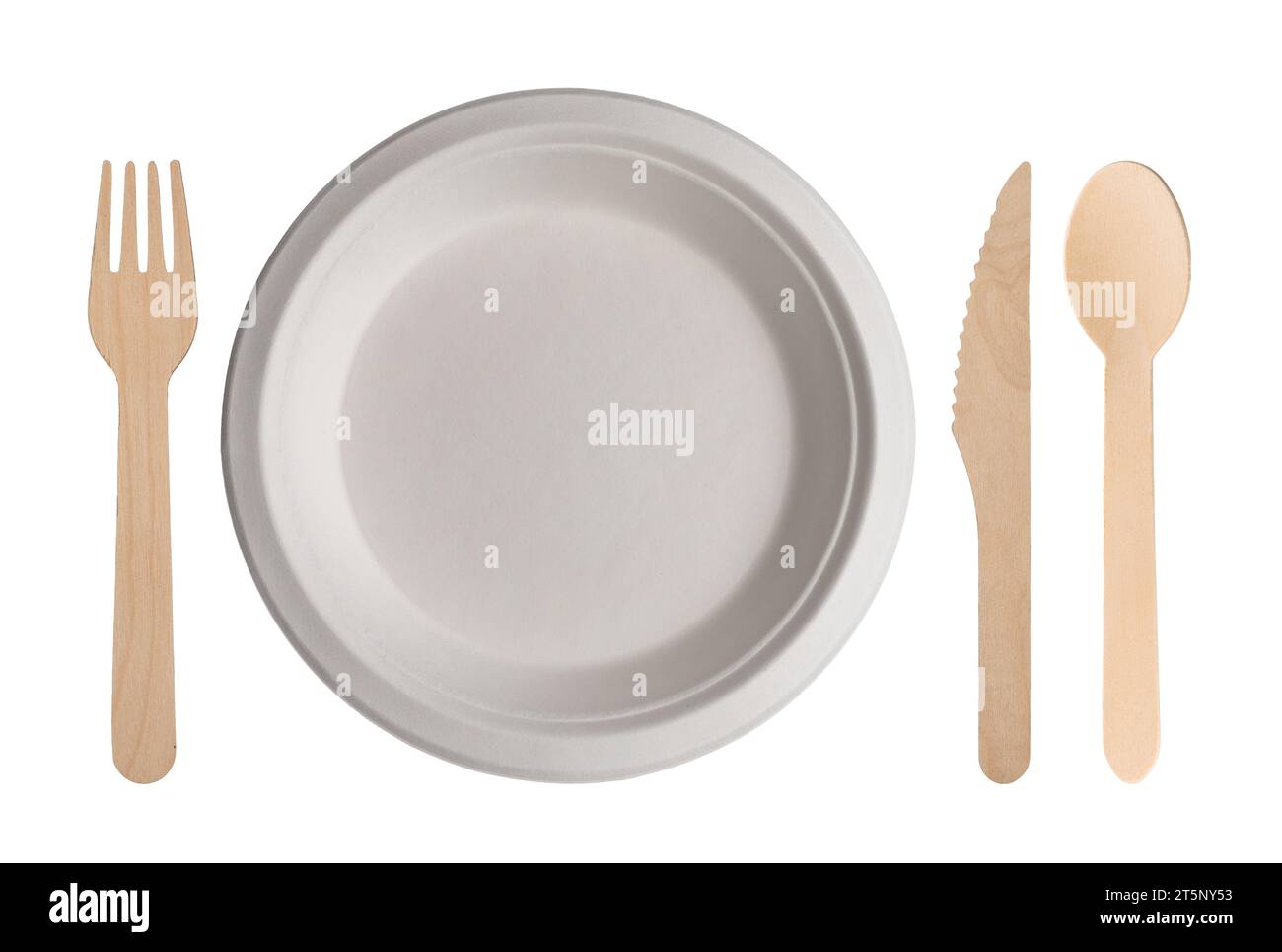 Table set with white cardboard plate with wooden cutlery next to it. Biodegradable disposable plate, fork, spoon and knife isolated on white with clip Stock Photo