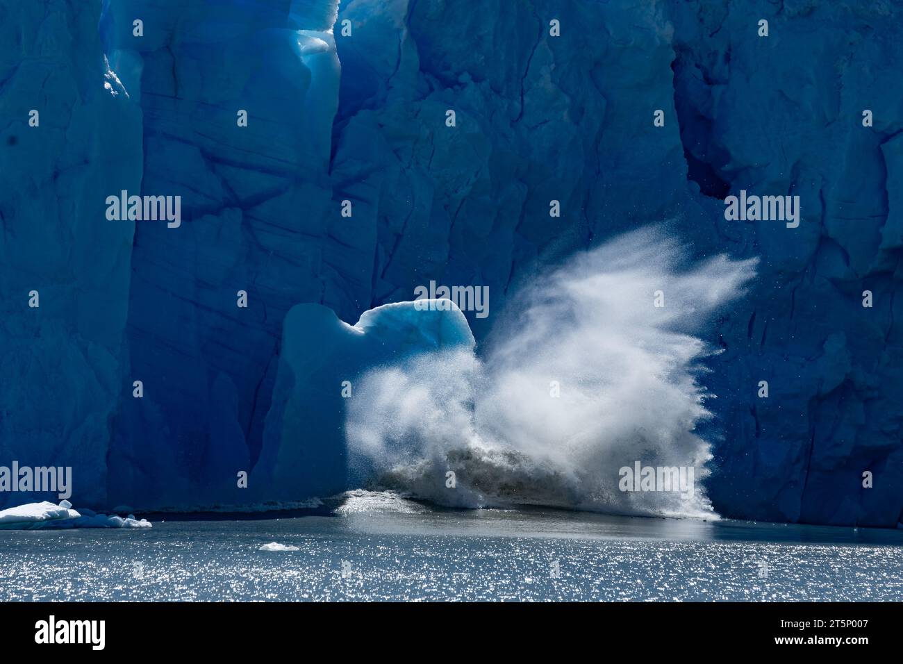 A big ice chunk falls from Perito Moreno Glacier, in Argentina Stock Photo