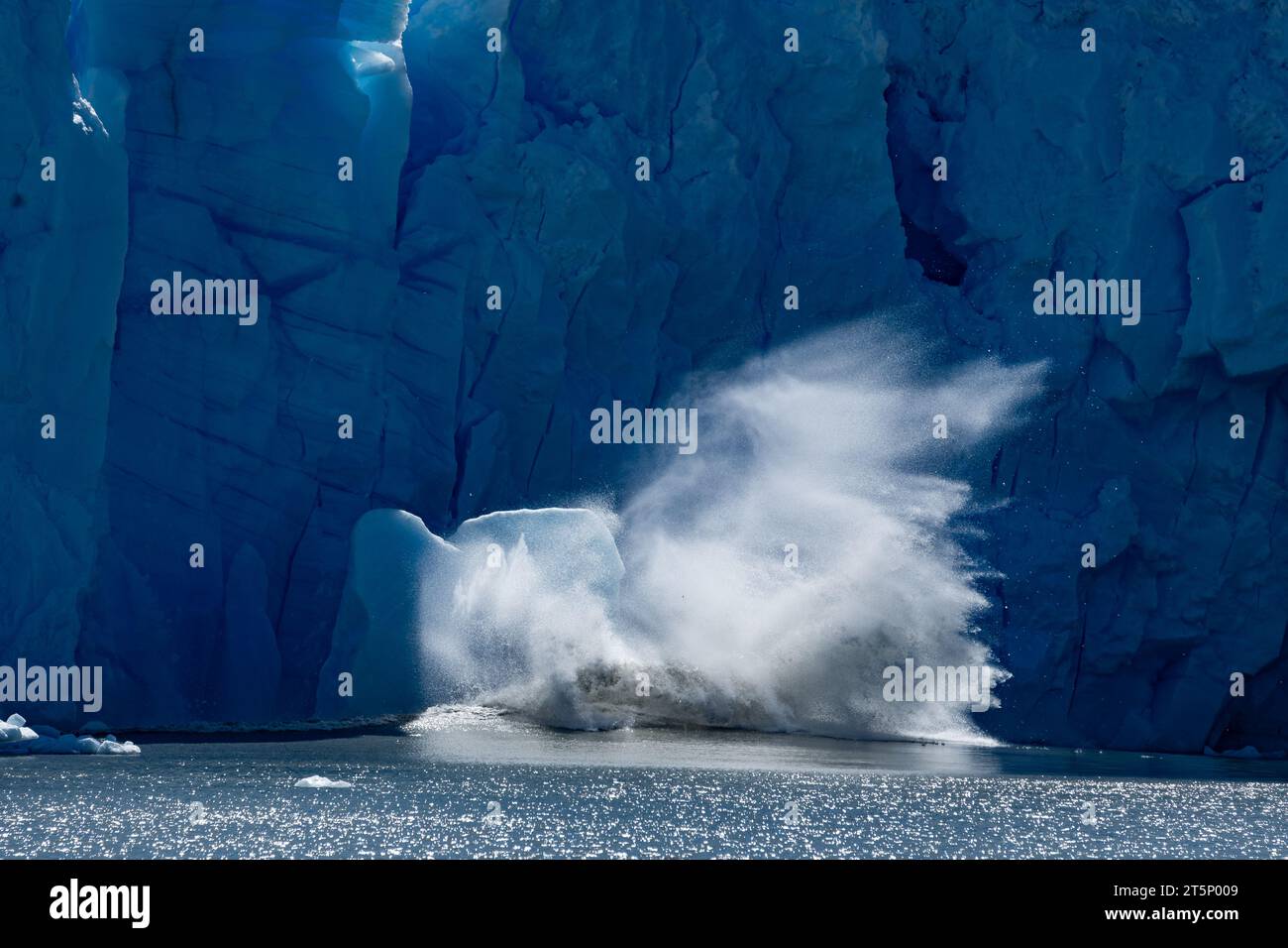 A big ice chunk falls from Perito Moreno Glacier, in Argentina Stock Photo