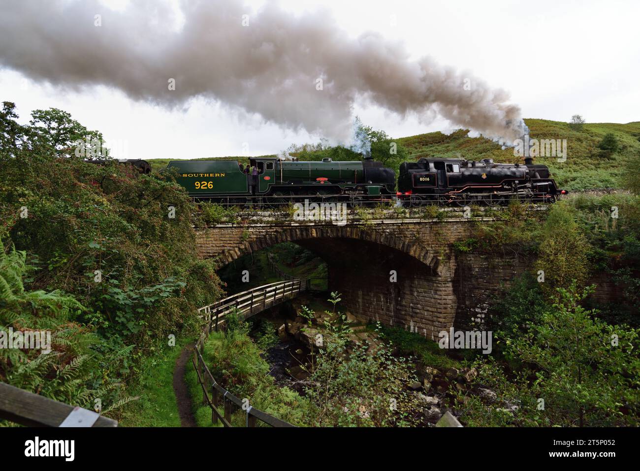 BR Standard Class 4 tank No 80136 (running as 80116) and SR Schools Class No 926 Repton at Water Arc on the North Yorkshire Moors Railway. Stock Photo