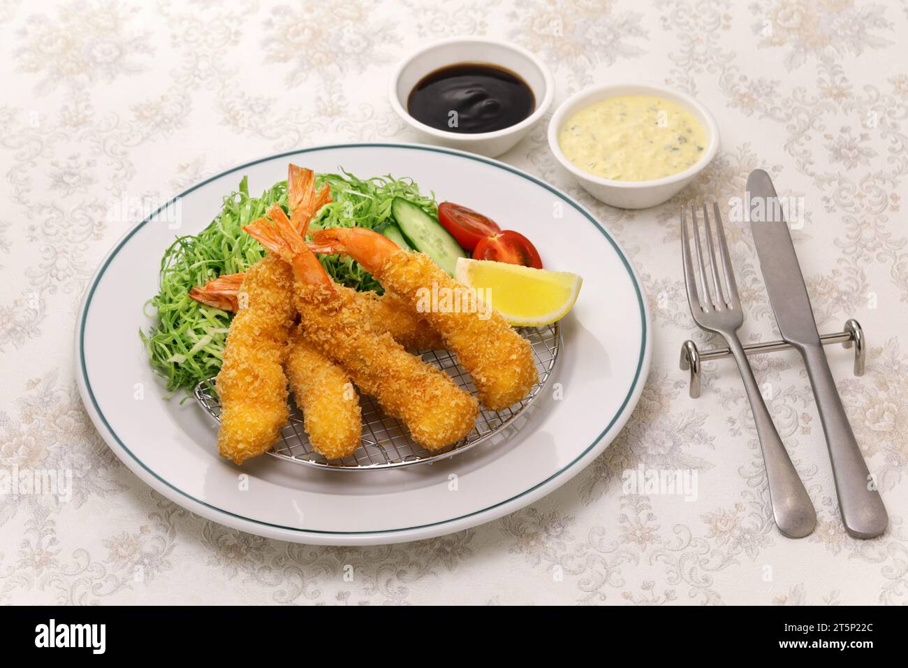 Japanese Ebi Fry is shrimp that has been peeled, coated in flour, dipped in egg batter, then breaded and fried in oil. Stock Photo