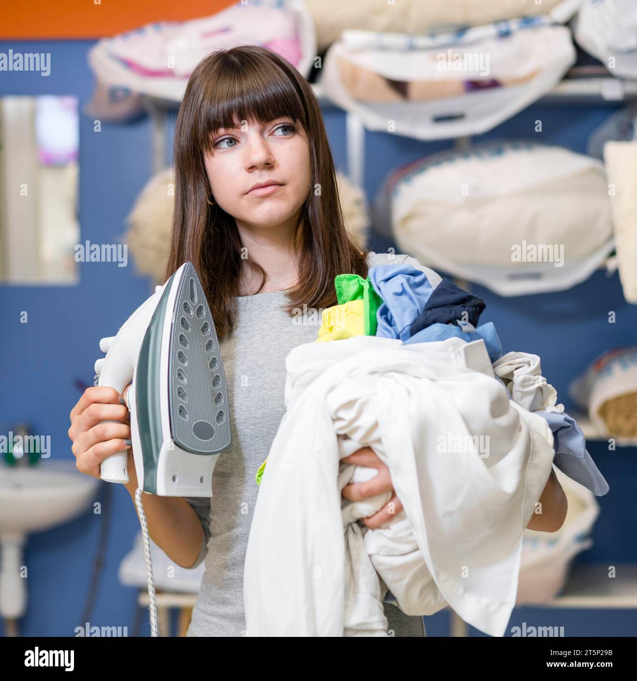 Woman Holding Laundry Clothing Iron Stock Photo - Alamy