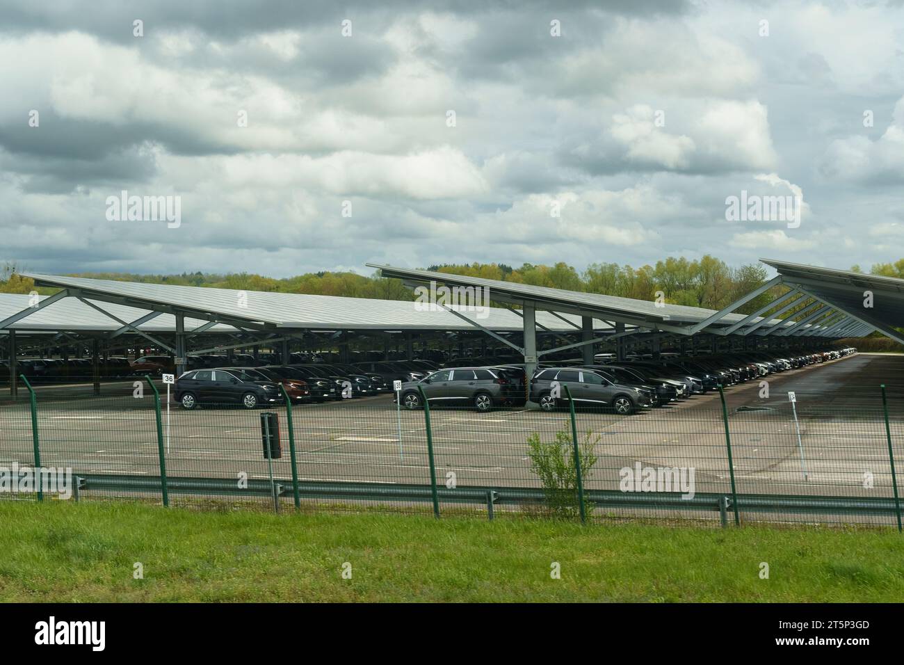 Montbeliard, France - April 28, 2023: New Peugeot cars stand in the covered parking lot of the PSA plant in France. Stock Photo