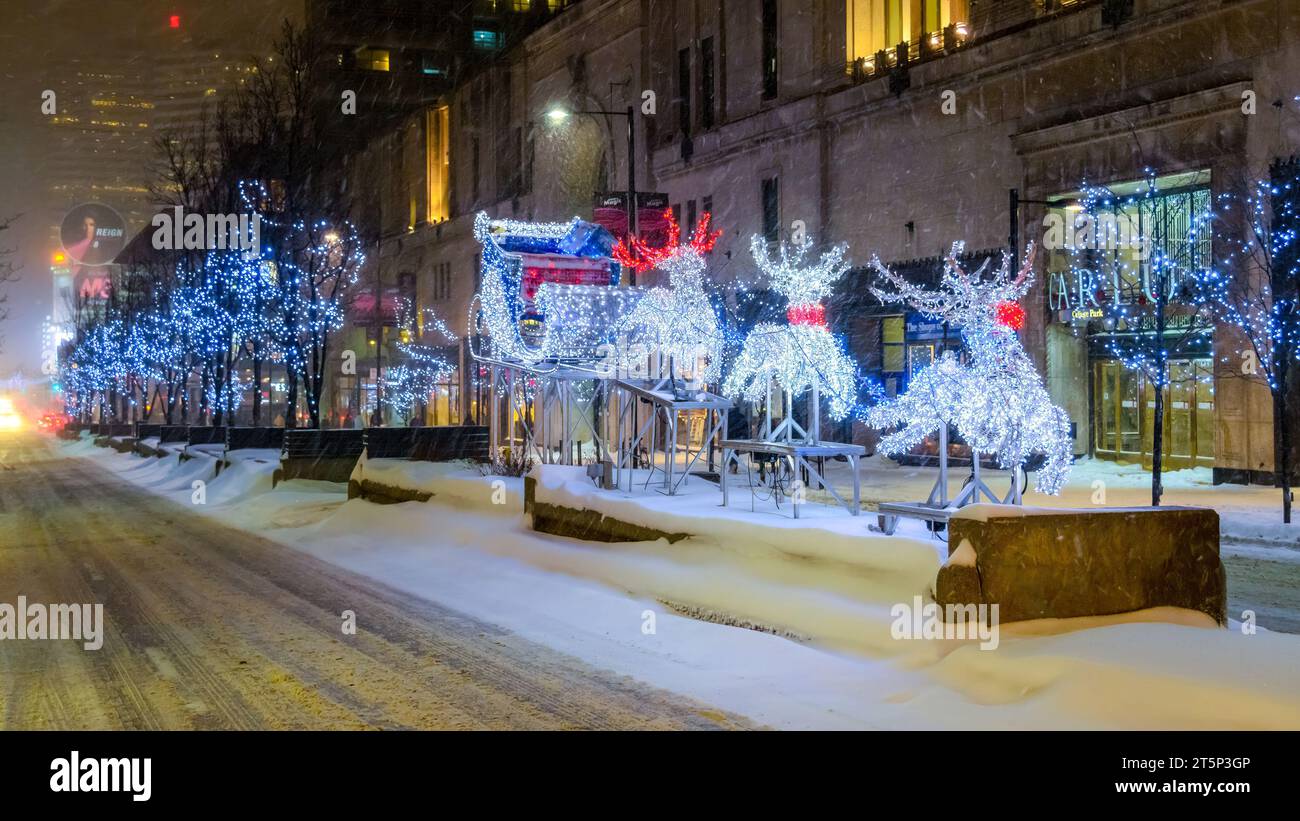 Toronto, Canada - Dec. 14, 2013: Christmas lights of reindeers in College and Yonge Street intersection. Night scene of illuminated symbols Stock Photo